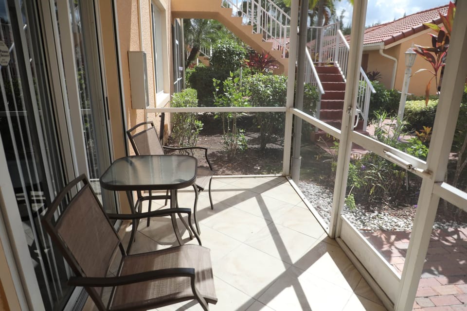 Front lanai for sunny afternoon reads. Wonderful cross breeze through unit.