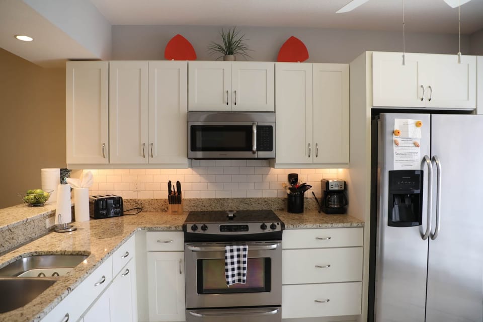 light and bright kitchen with 9' tall ceilings. Fully stocked for your use.