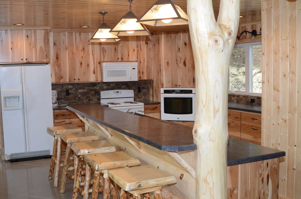 Kitchen with 11' island, dishwasher, range, second oven, microwave plus a pantry