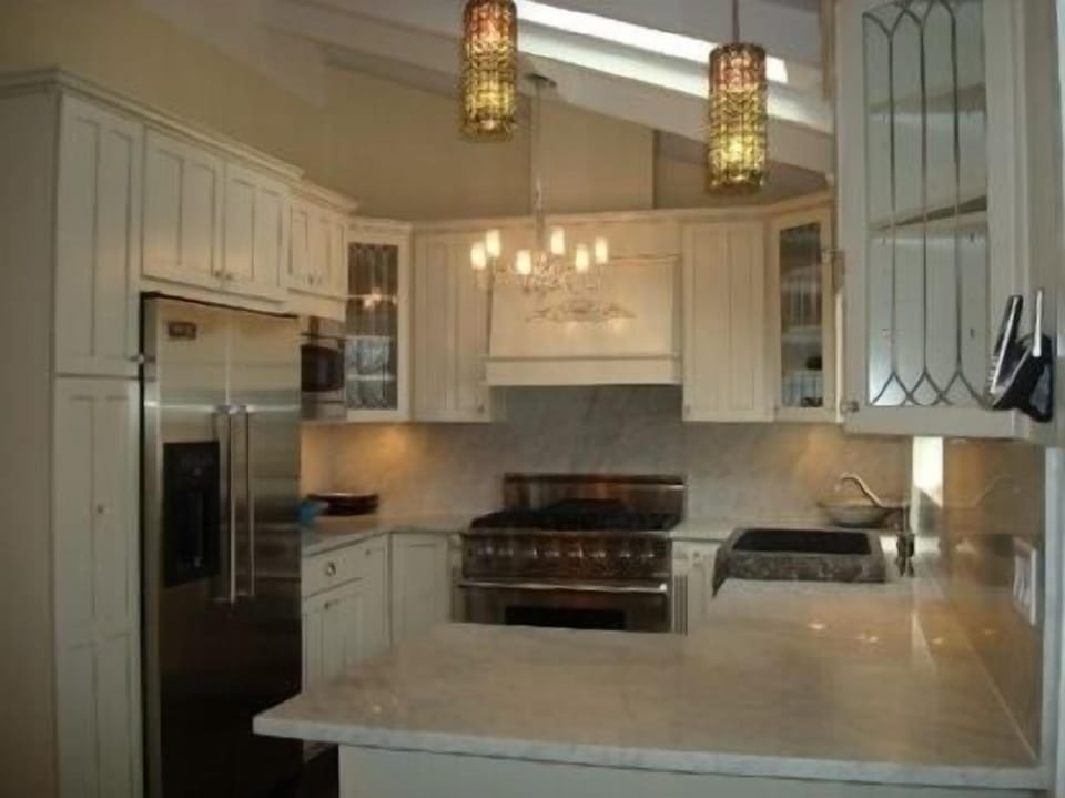 All Viking Appliances, Carrara Marble Counters
Crystal Chandeliers