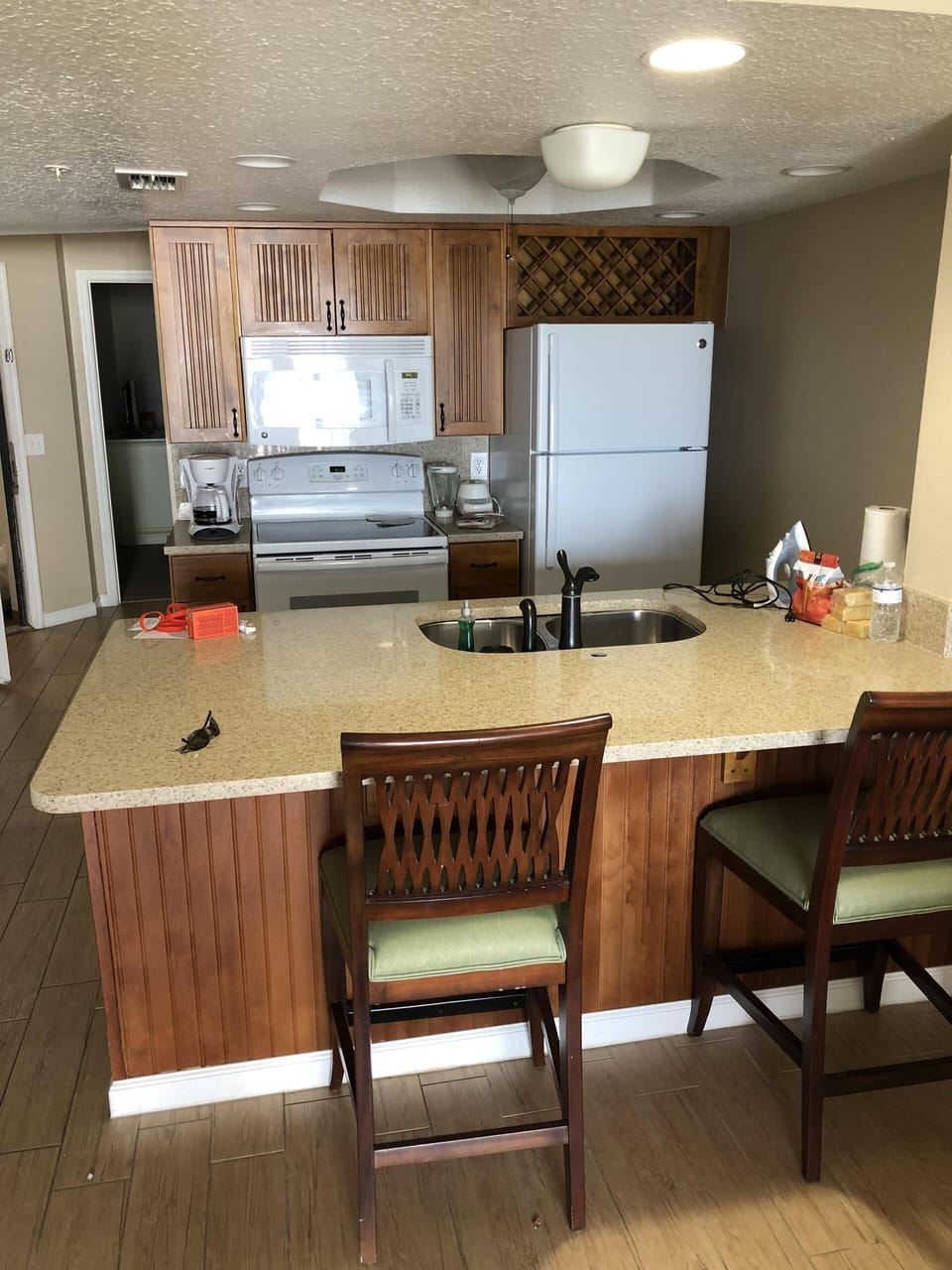 large kitchen counter top and bar stools