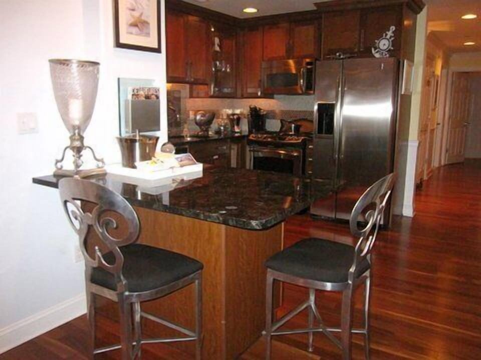 CUSTOM STATE OF ART KITCHEN AND ISLAND WITH BUILT IN WINE COOLER AND BAR STOOLS