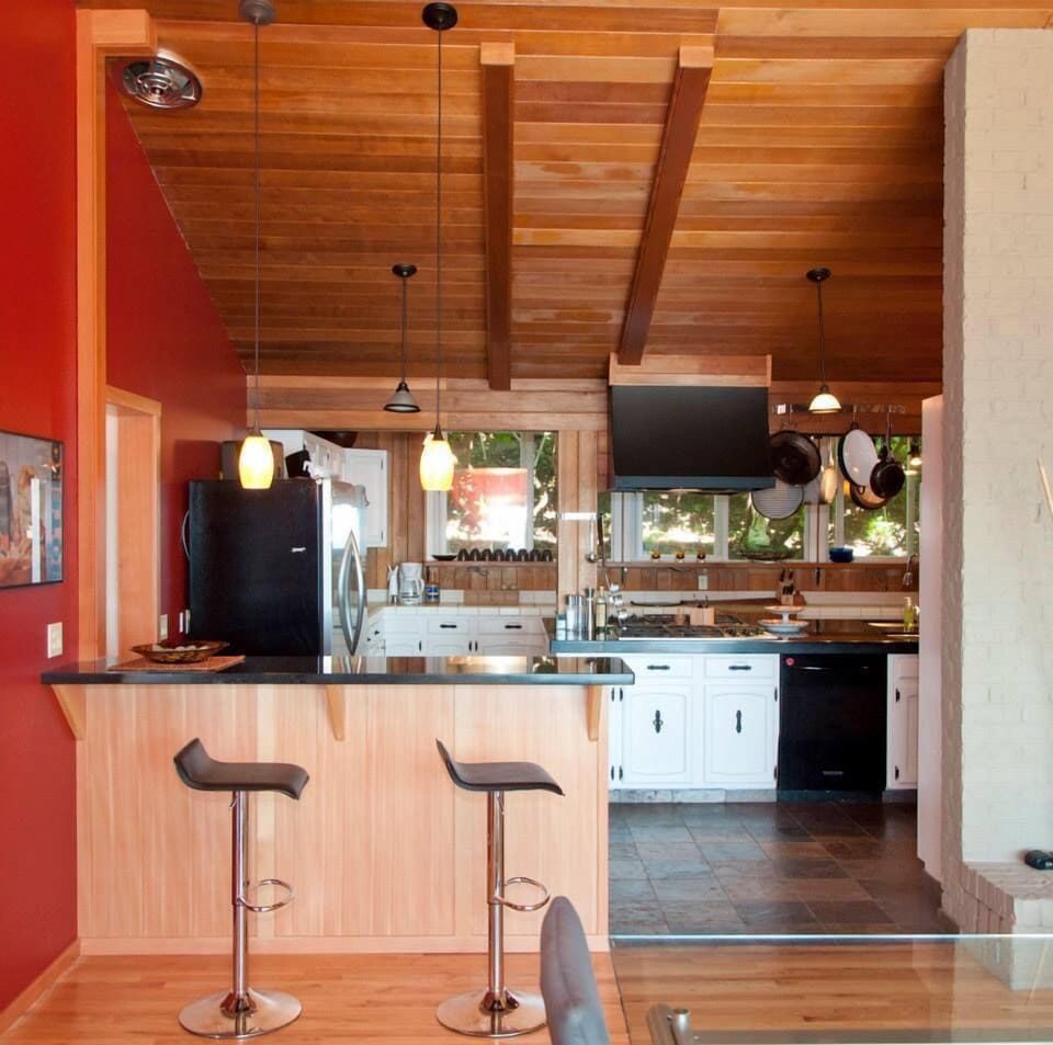 Bar that is open to the kitchen and dining room.
