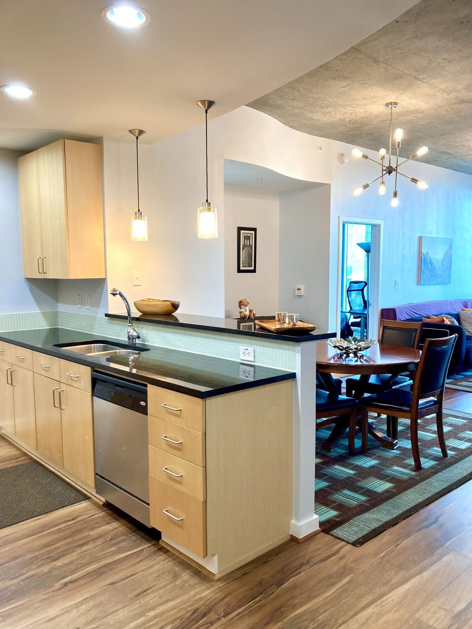 Kitchen with stainless steel appliances and granite counter tops.