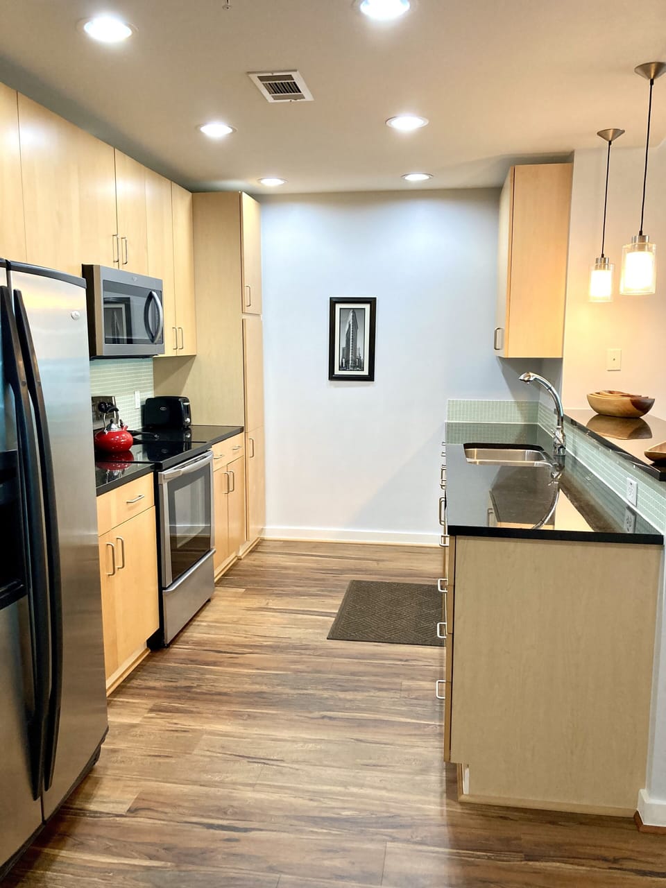 Kitchen with stainless steel appliances and granite counter tops.
