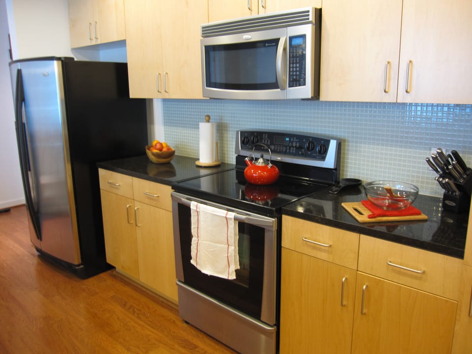 Kitchen with stainless steel appliances and granite counter tops.