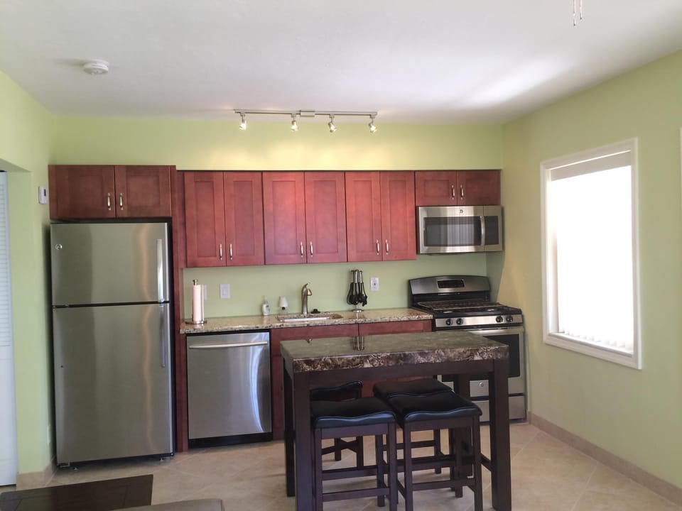 Custom cabinets and stainless steel appliances.