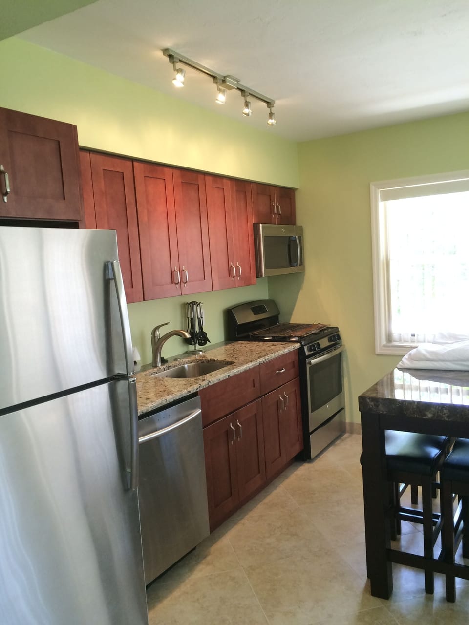 Another view of kitchen.Microwave and dishwasher