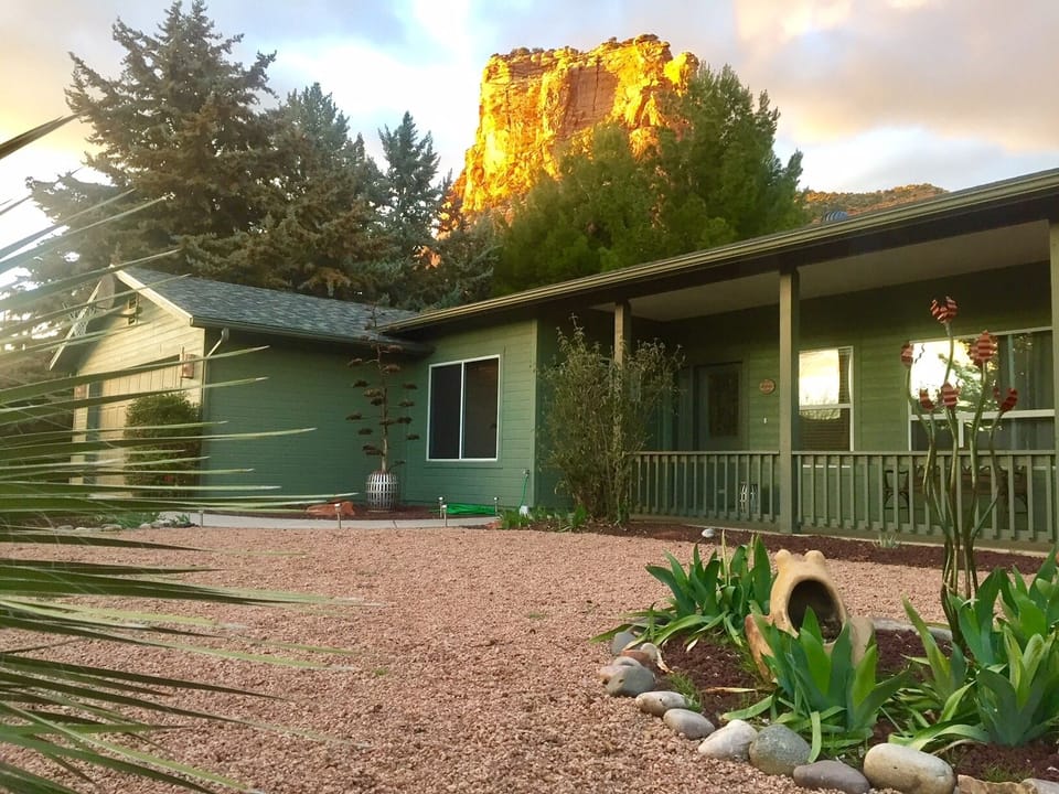 Front of home with Castle Rock glowing in the background.
