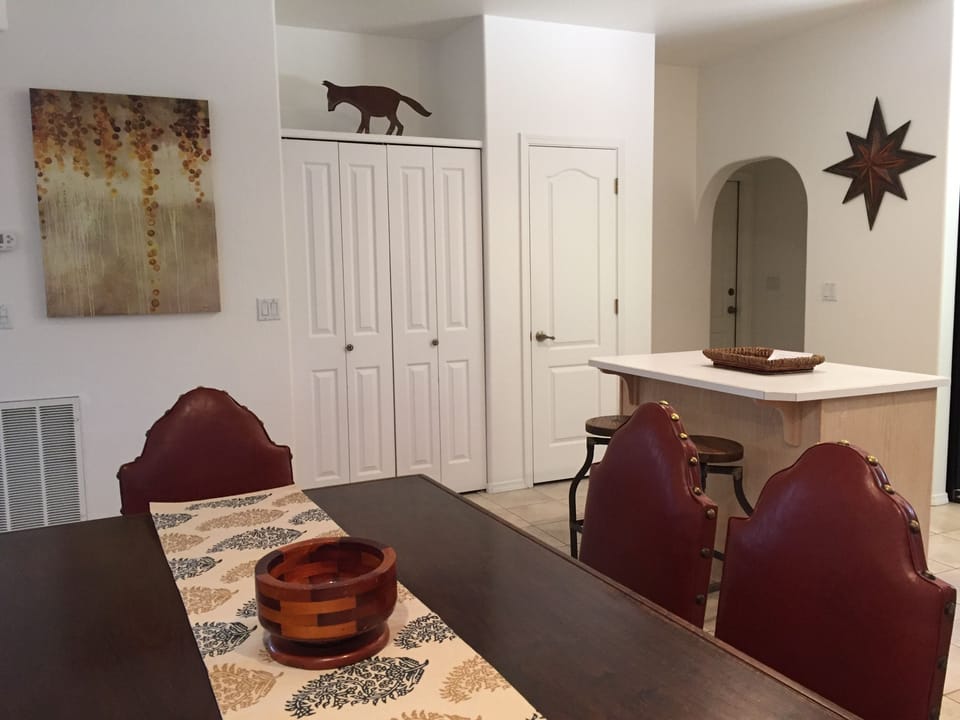 Authentic Italian black walnut dining room table seats 6 and extends for guests.