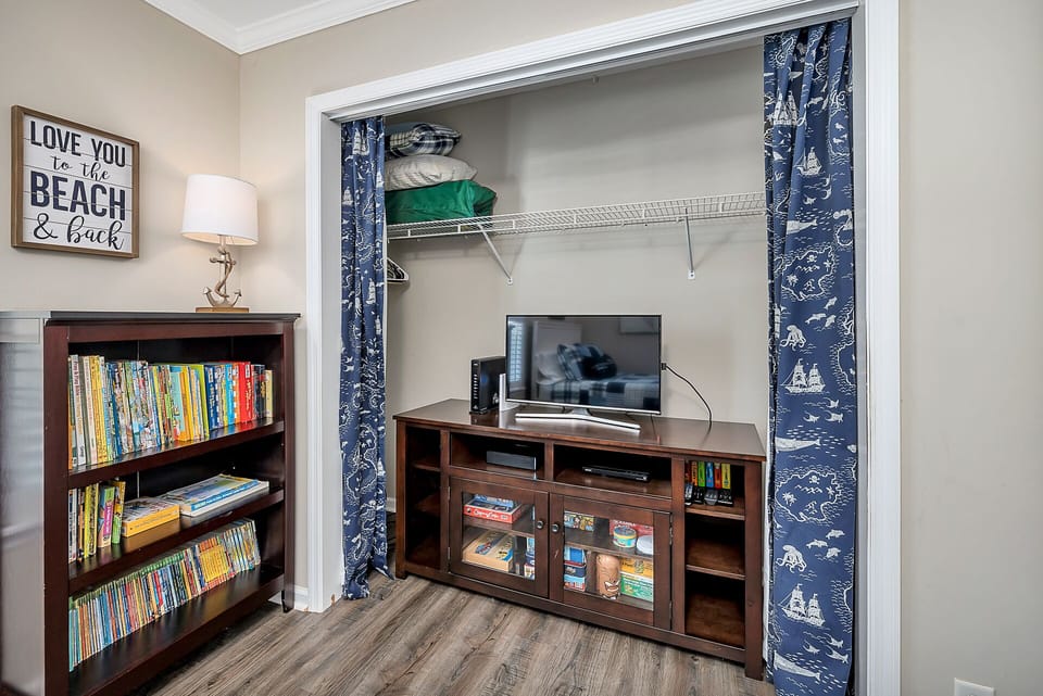 Lots of books, movies, games and their own TV! Closet also stores a pack-n-play.