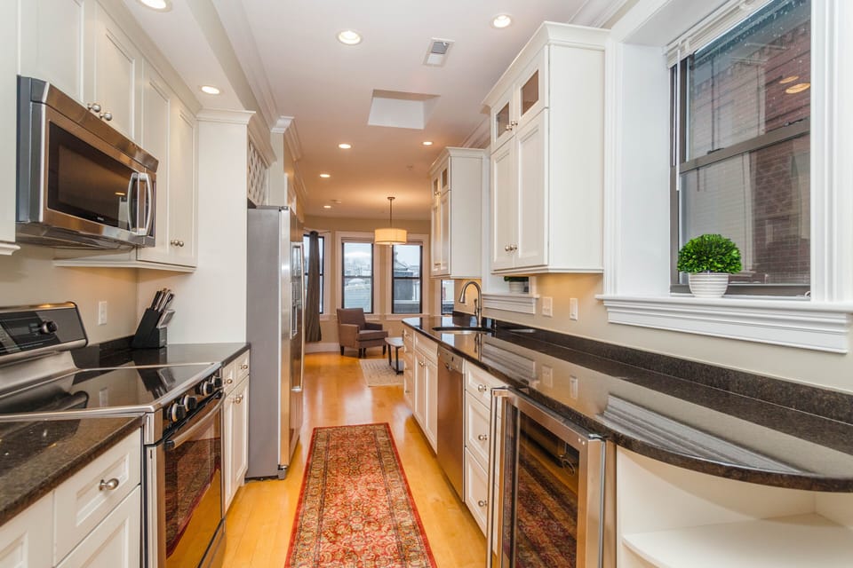 Kitchen with Skylights, granite counters and wine refrigerator