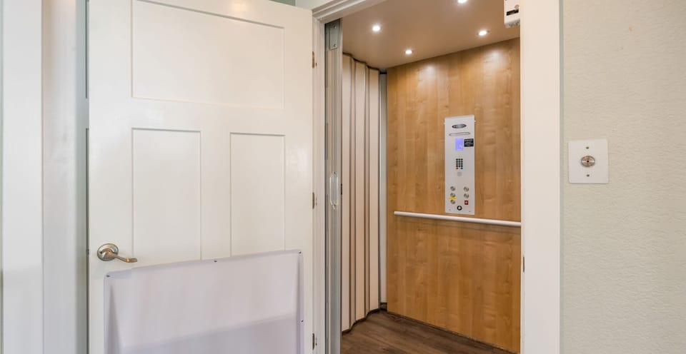 Surf or Sound Realty - 858 - Rain Dance - Elevator - Label