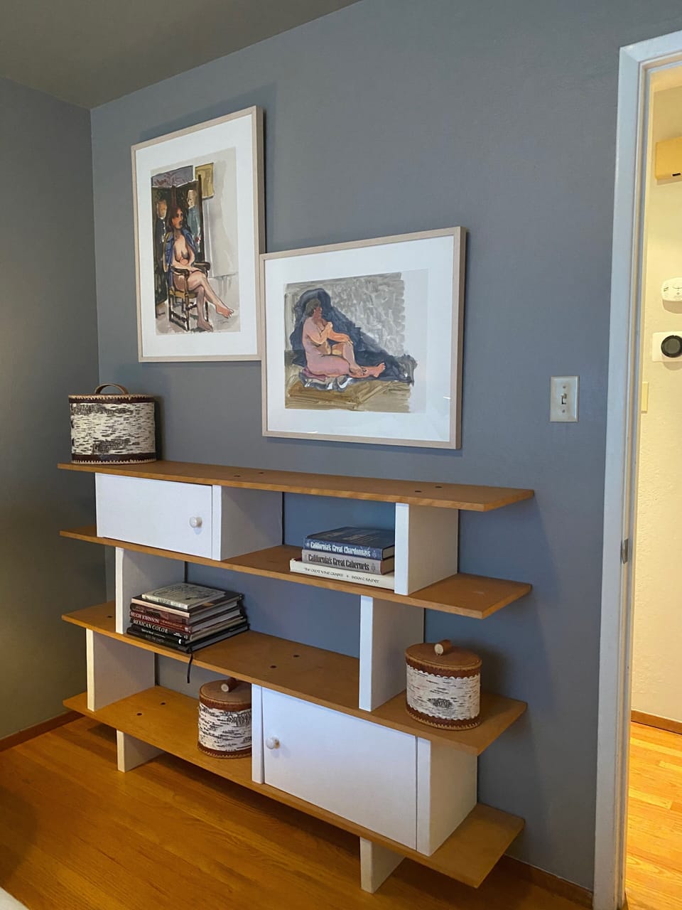 Wine library in guest room , with queen bed.