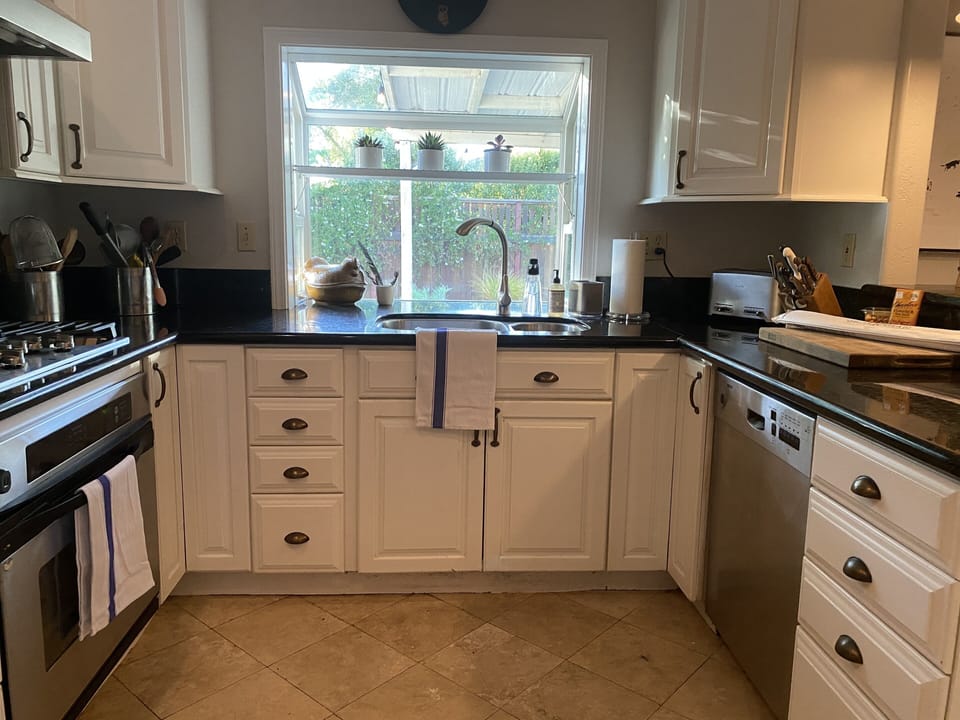 Modern open kitchen outfitted with Heath plates, All
Clad pans and lots more