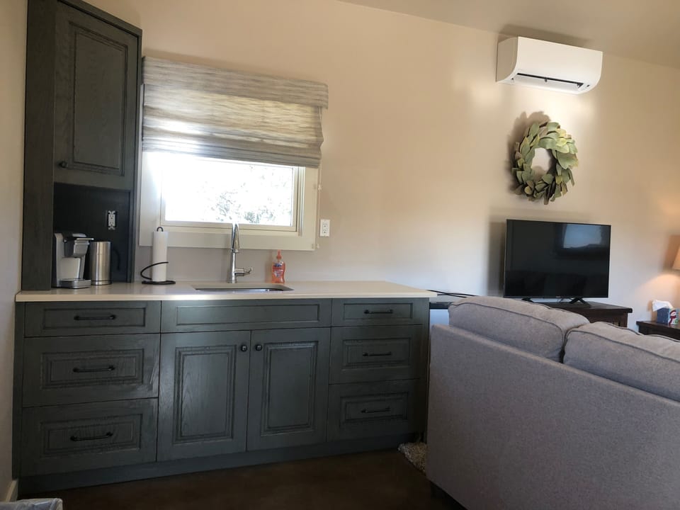 Kitchenette with coffee maker, microwave, and mini-fridge