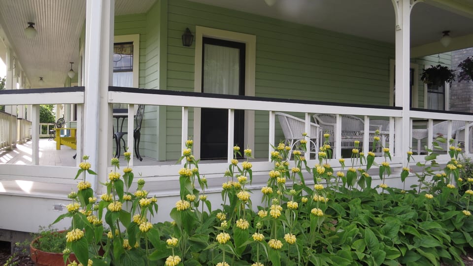 Your private porch with exterior entrance and outdoor furniture. 