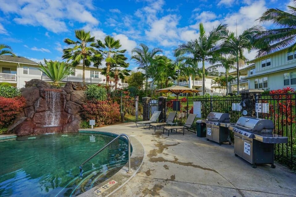 Pool & Jacuzzi with Cascading Waterfall and BBQ area.