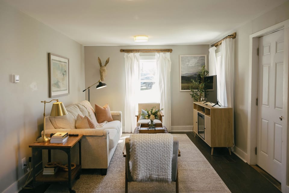 Cozy living room with comfortable seating and natural light.