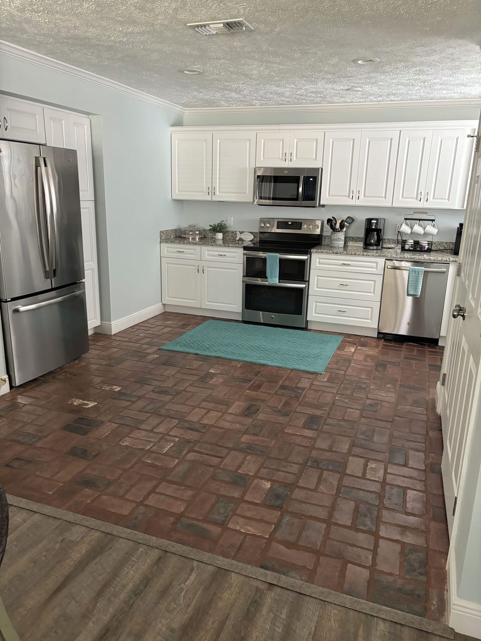 Spacious kitchen, real brick floors