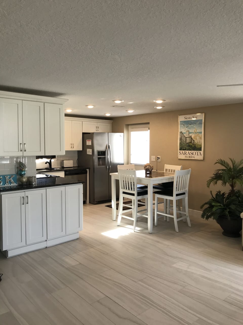 Full kitchen with stainless steel appliances. 