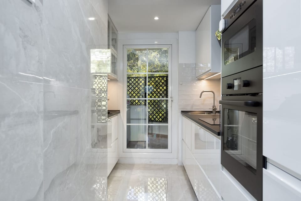 Kitchen with an outdoor laundry area - 