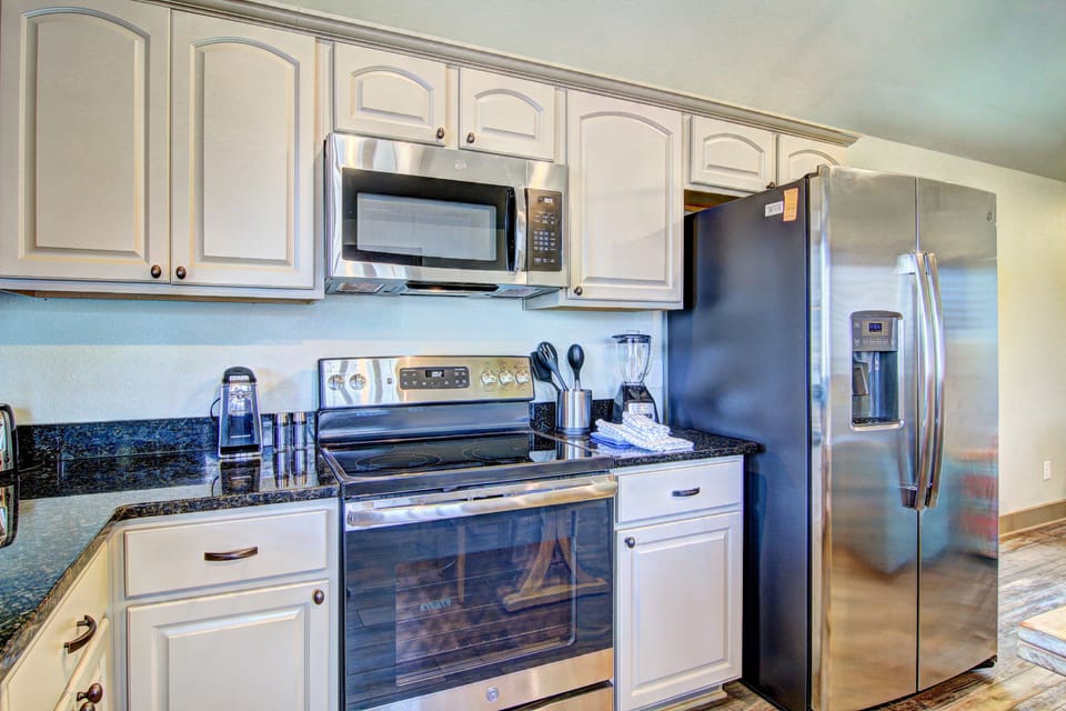 Kitchen - Experience culinary charm in this cozy vacation rental kitchen
