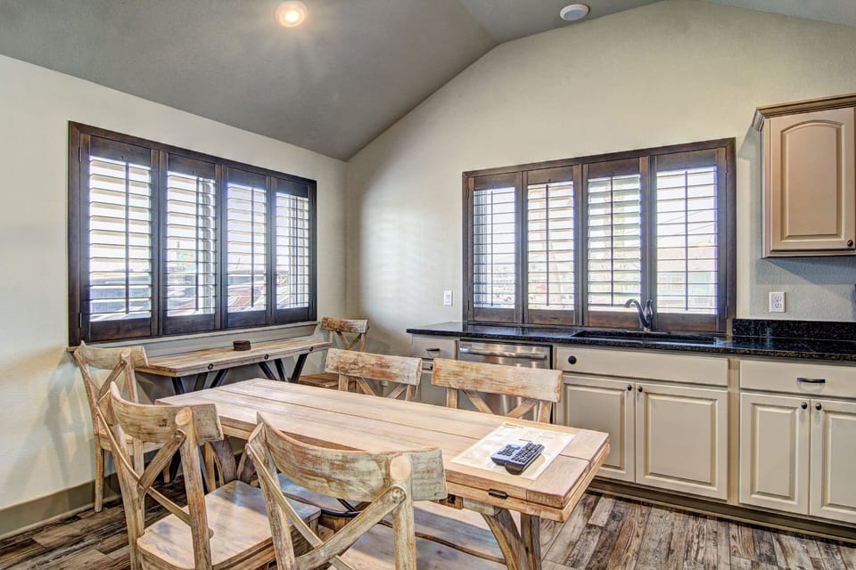 Your spacious kitchen and dining area features rustic charm with modern conveniences, perfect for preparing meals and gathering together.