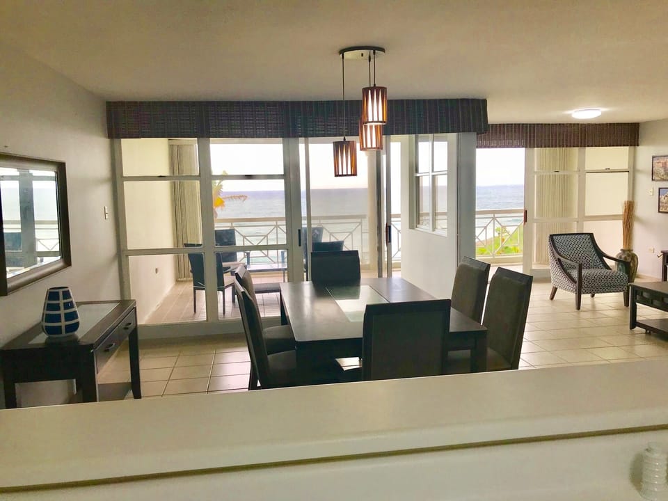View from open concept kitchen. Dinning room left, TV living room right.