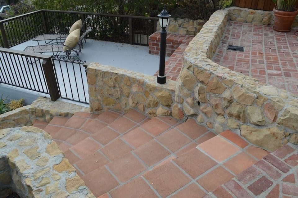 Front steps leading to the house and lower sun porch