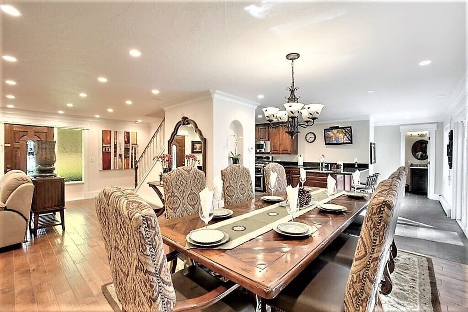 Great Room A Large customer designed Dinning table for 12. Addition chair inside Garage