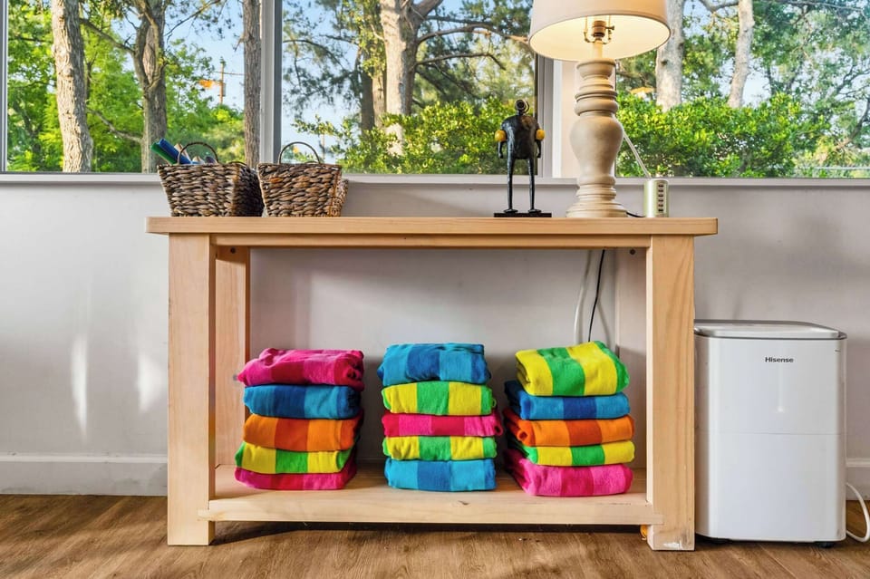 Brightly colored towels and a handy mini fridge, ready for your day by the water