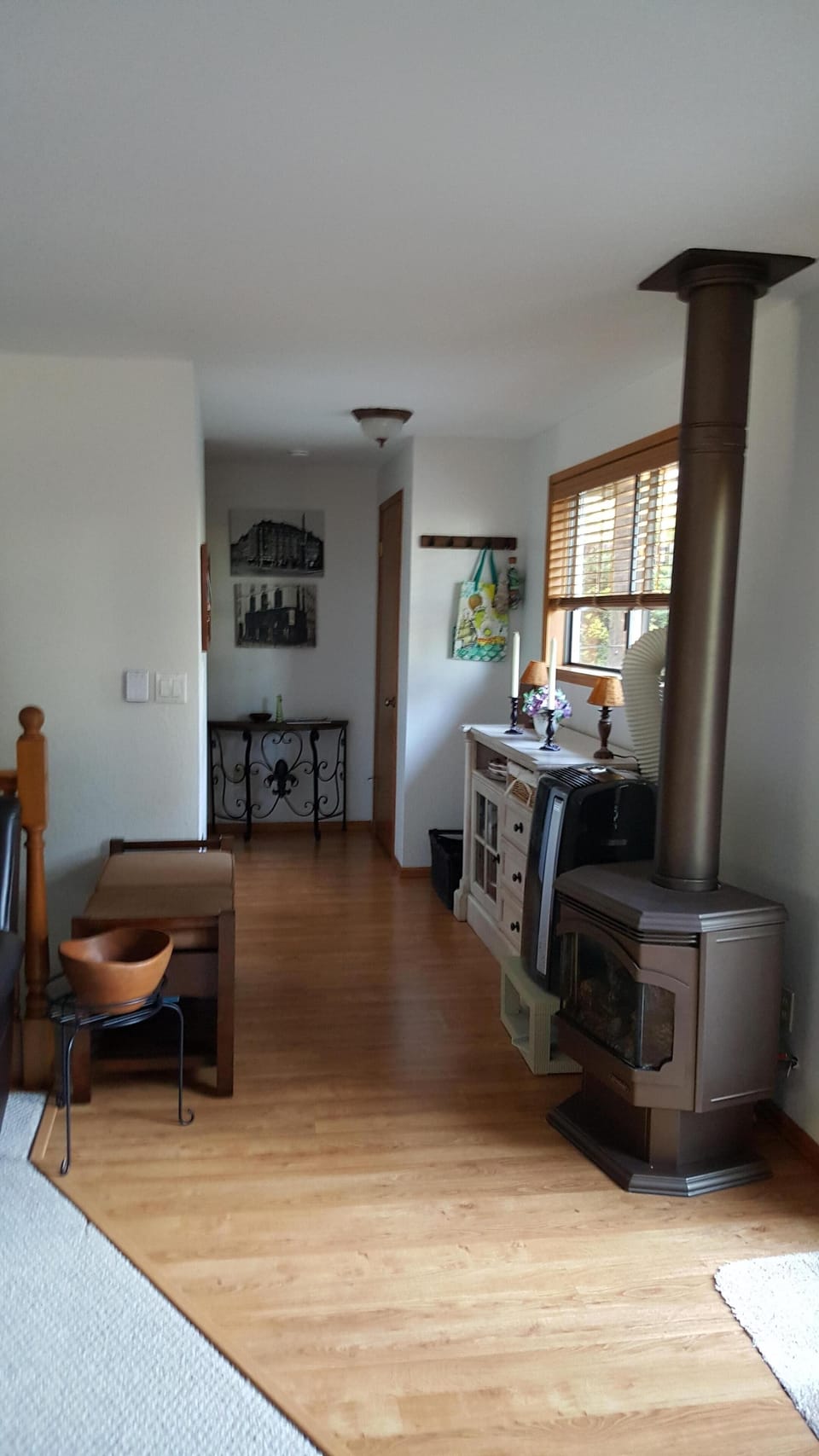Right of entry - free standing fireplace type gas stove, hallway to bedrooms
