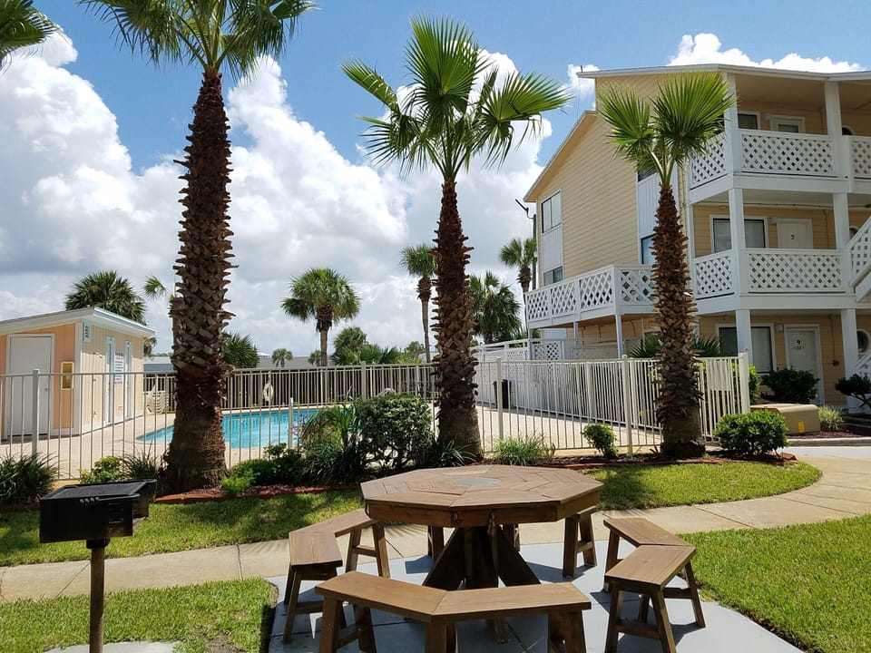 Is enjoy barbecuing outdoors with picnic benches 