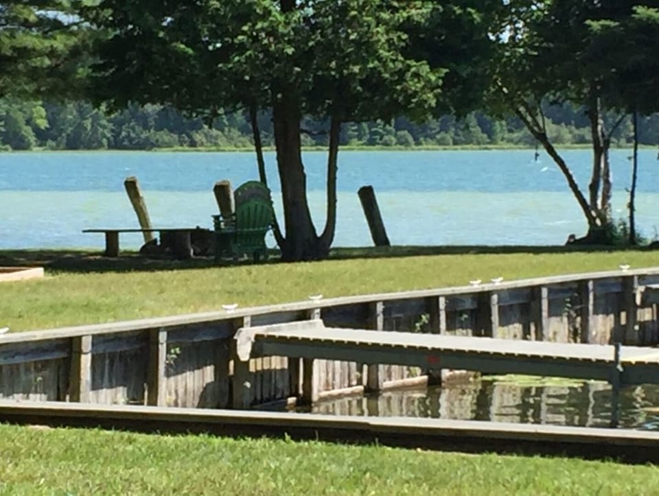 Boat slips with fire pit in distance.