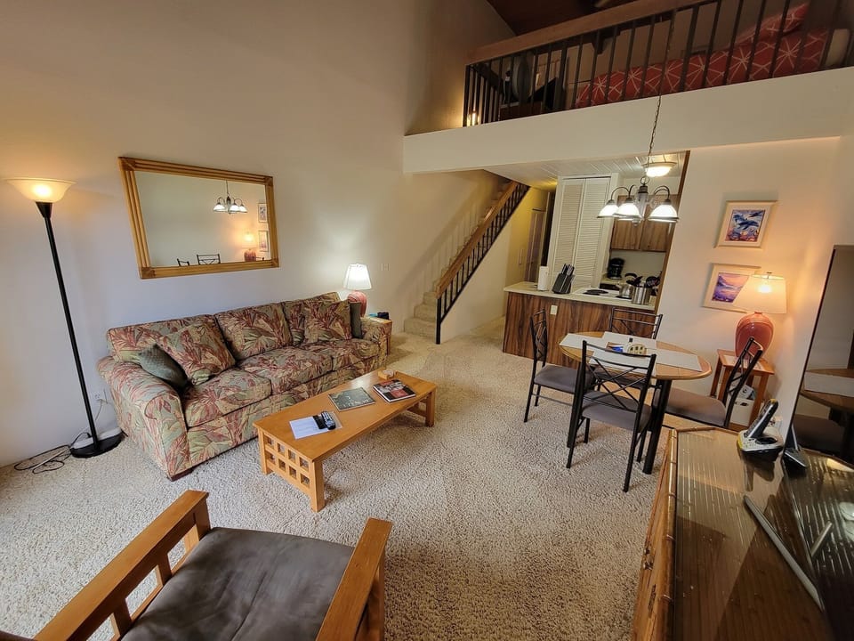 Living, dining and kitchen with access to loft bedroom