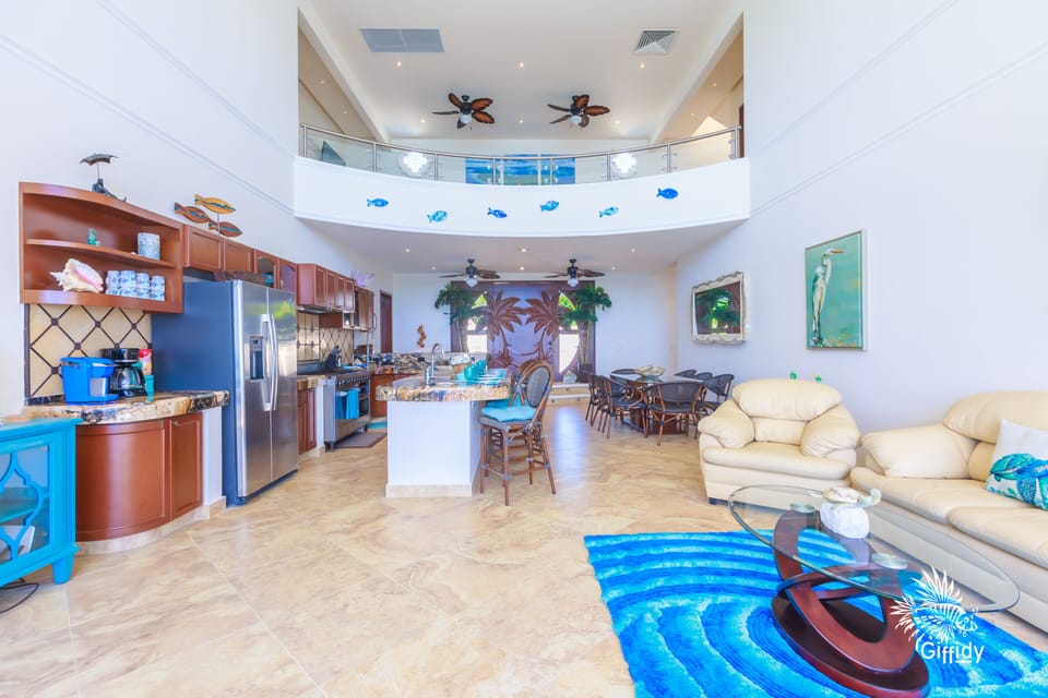 Gourmet kitchen with chef's stove, bar sink, ice and water in the fridge door.