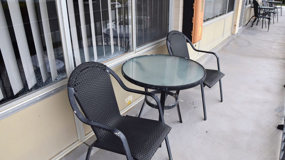 Table and chairs outside unit 6
