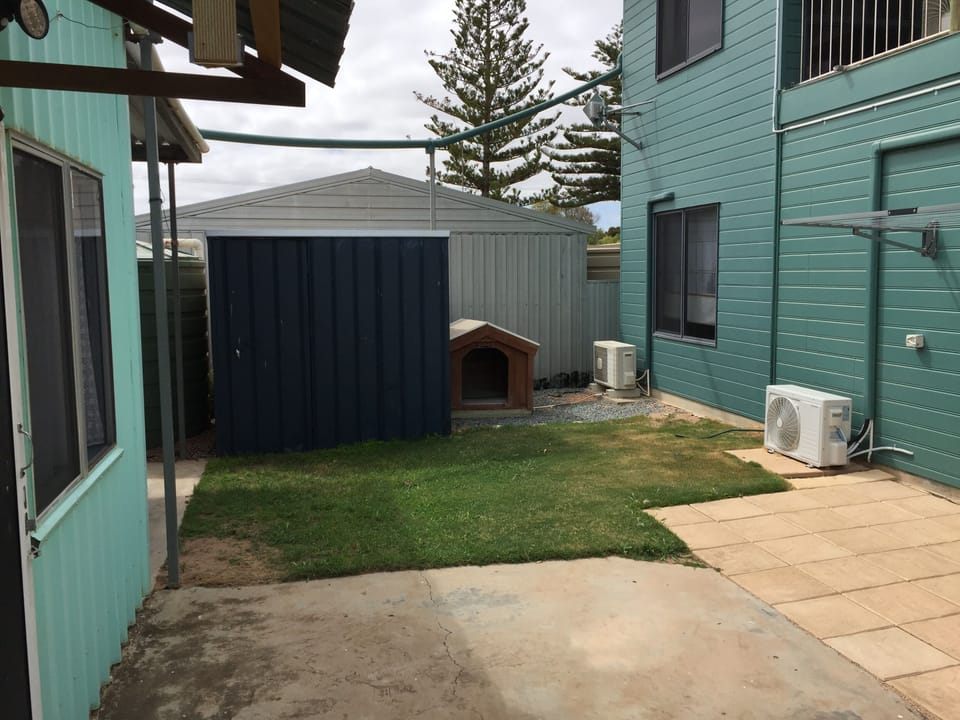 Lawn area and kennel.