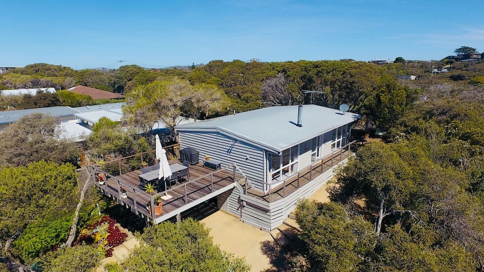 Outdoor living is key is this stylish Blairgowrie beach cottage.  Spacious decking with tree top views across to the bay beach.