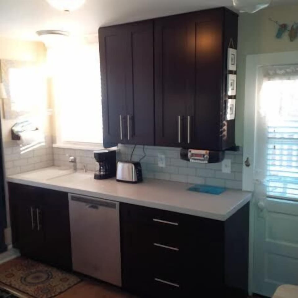 Complete kitchen along with dishwasher, coffee maker, toaster and blender 