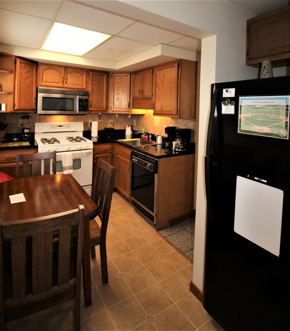 Eat in kitchen with a full size refrigerator with automatic icemaker.