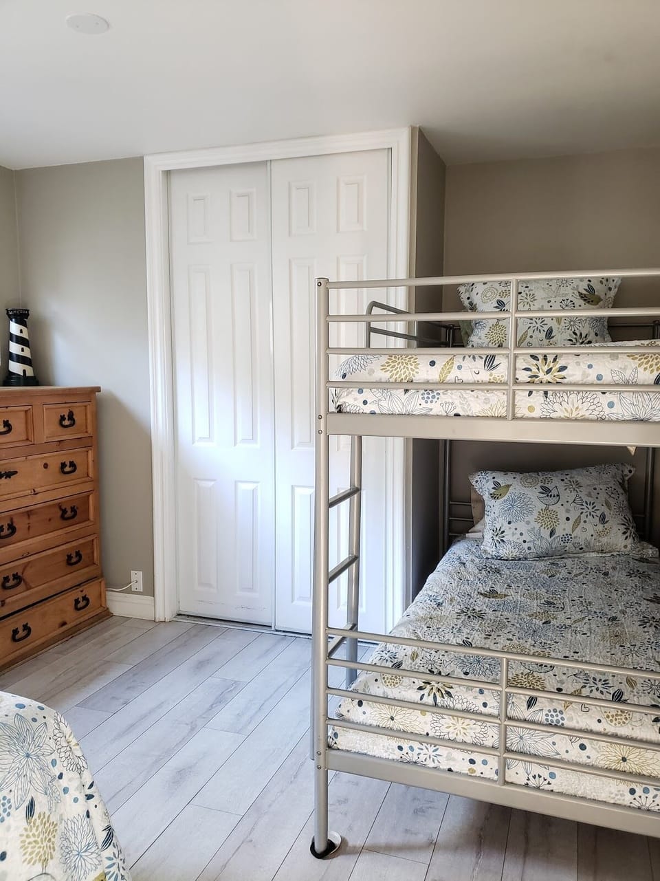 2nd bedroom with one twin bed and a set of bunk beds