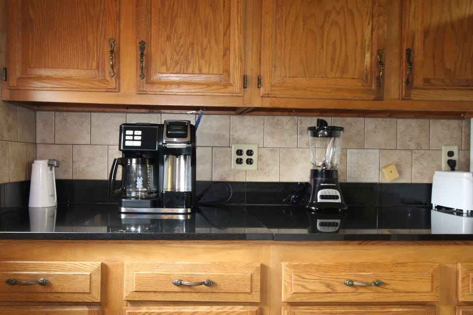 Granite countertops, tiled backsplash and all the kitchen appliances you'll need for a comfortable stay