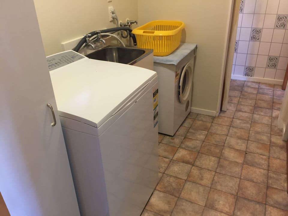 Large washing machine and dryer. Washing line also on back lawn.