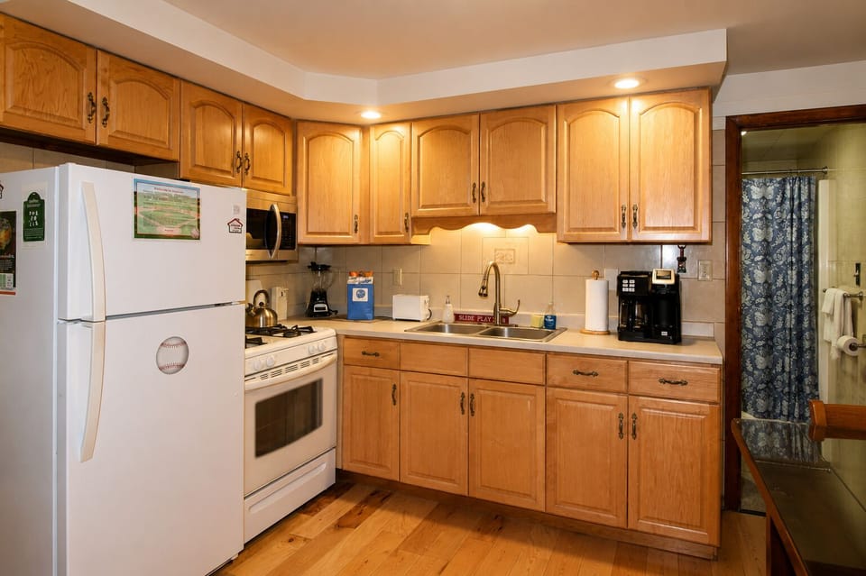 Spacious kitchen with gas stove, refrigerator with automatic ice maker and over the range microwave