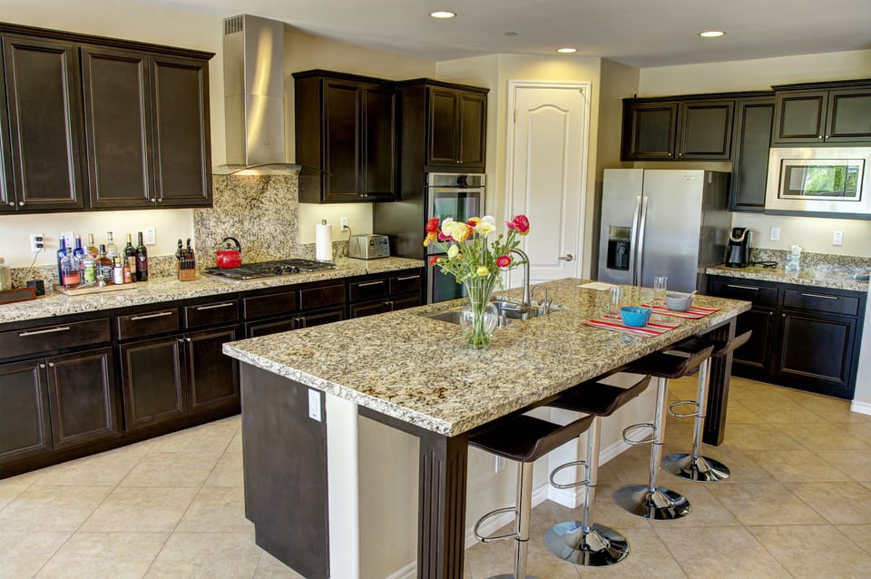 Modern open kitchen with new appliances.