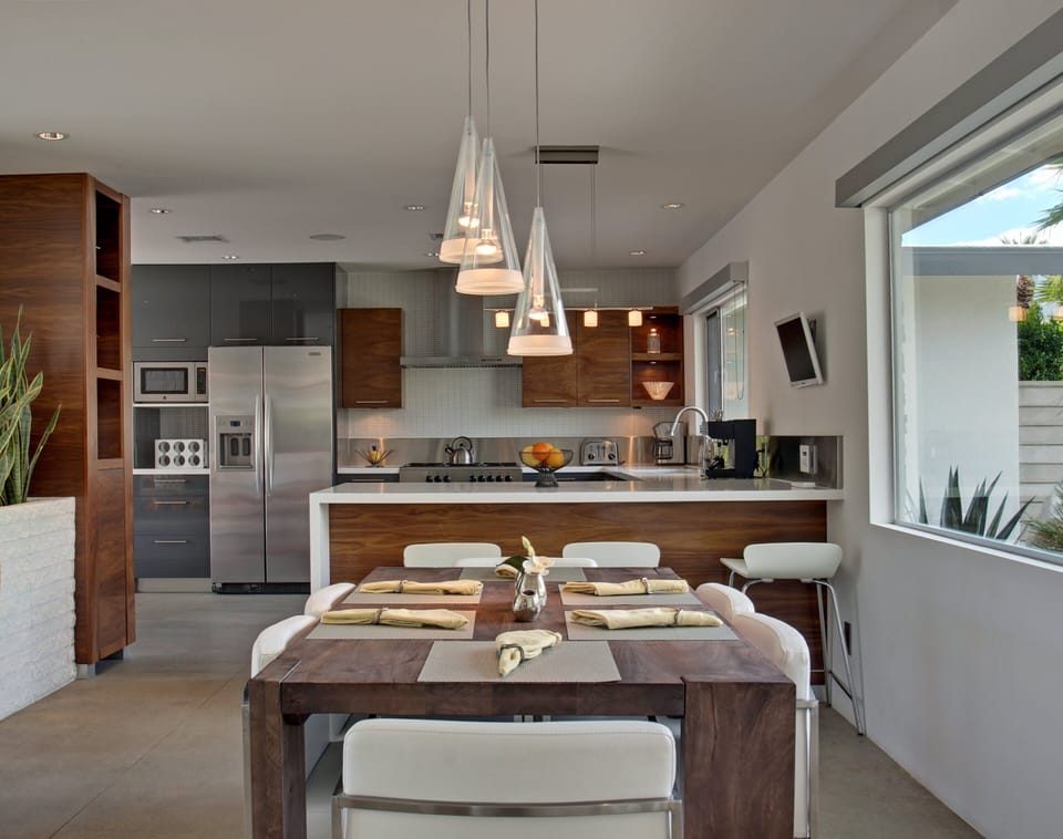 Dining Room and Counter with Bar Stools in Kitchen