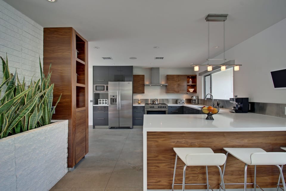 Brand New Ultra Sleek Kitchen with Stainless Steel Appliances, Walnut Accents