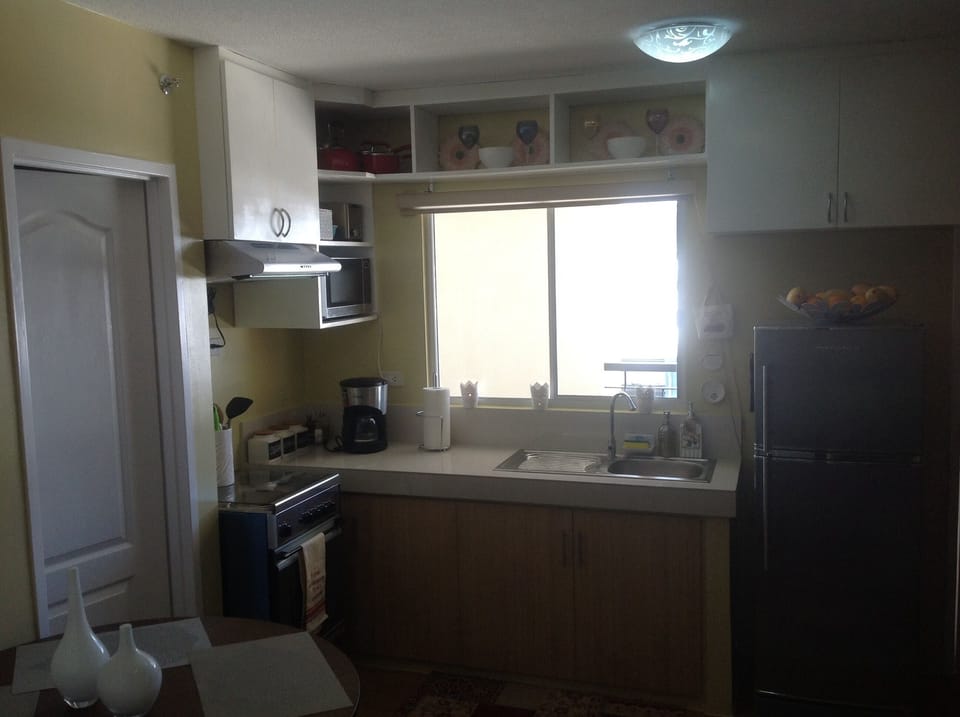 neighboring hillside view can be seen by the kitchen window
